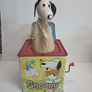 vintage Mattel Snoopy Jack-in-the-Box Music Toy from the 1950s